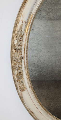 Large antique oval mirror with foxed mercury glass