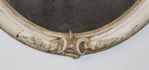 Large antique oval mirror with foxed mercury glass
