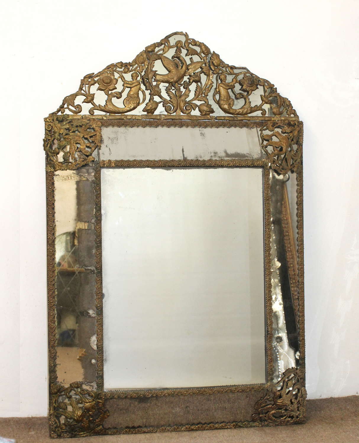 17th century cushioned mirror with gilt metal decoration