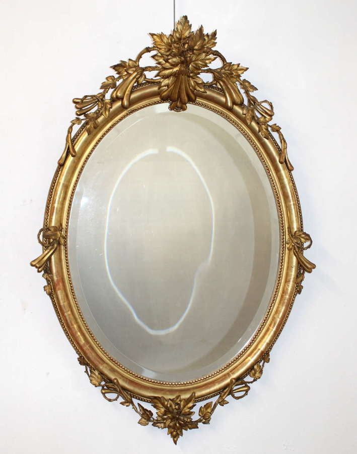 Large decorative antique French oval mirror