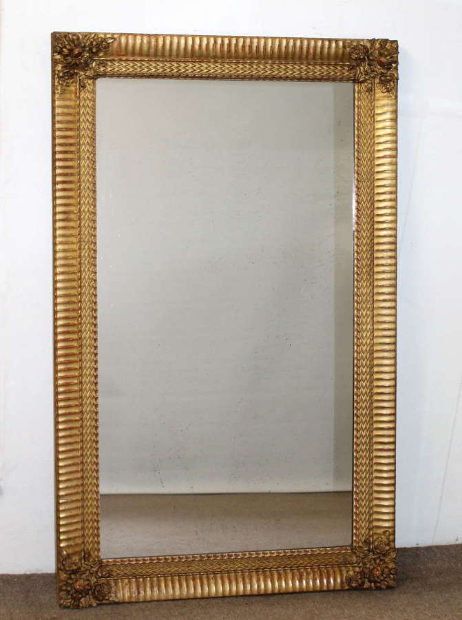 Handsome antique French mirror with wide gilt frame