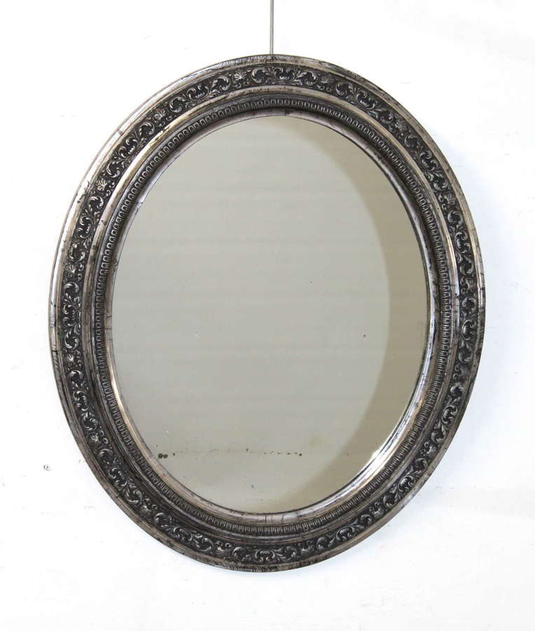 Antique French black and silver framed oval mirror