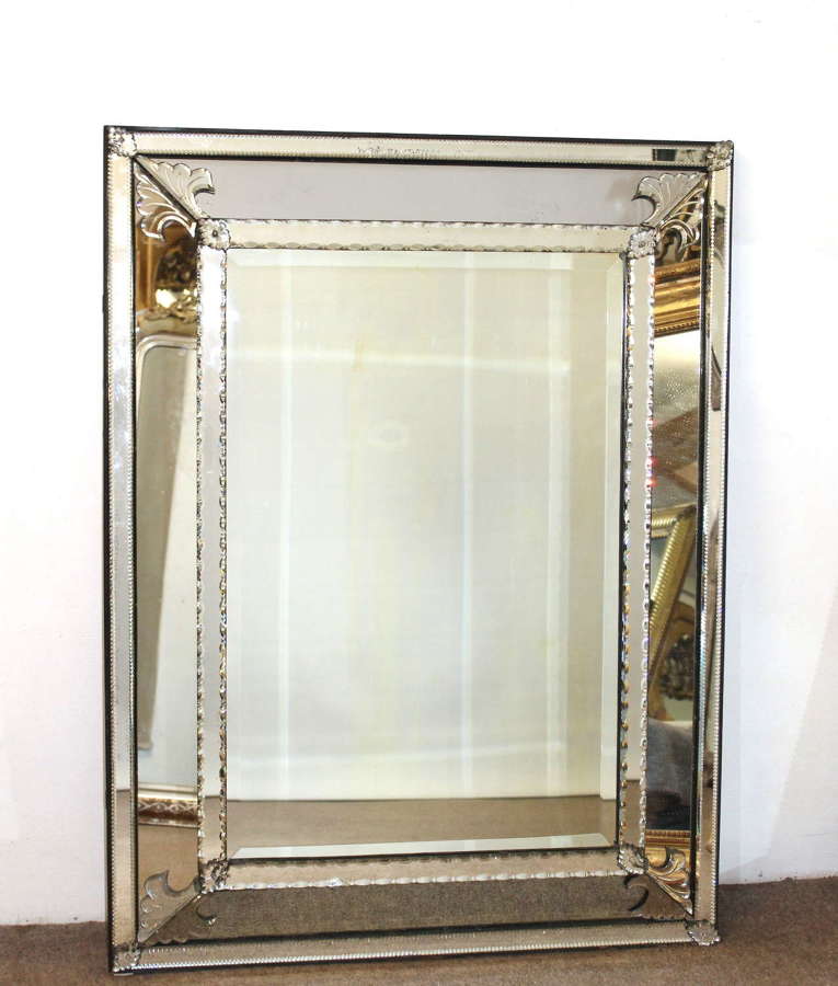 Antique cushioned Venetian mirror with fanned leaf corners