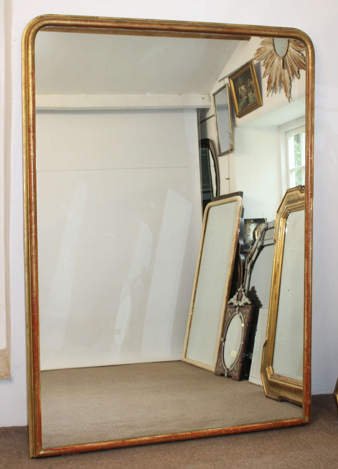 Very large narrow-framed antique French archtop mirror