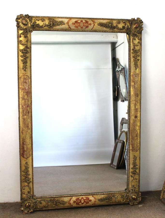 Antique Spanish mirror with decorative frame and mercury glass