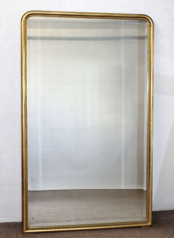 1920s French archtop mirror with narrow gilt frame