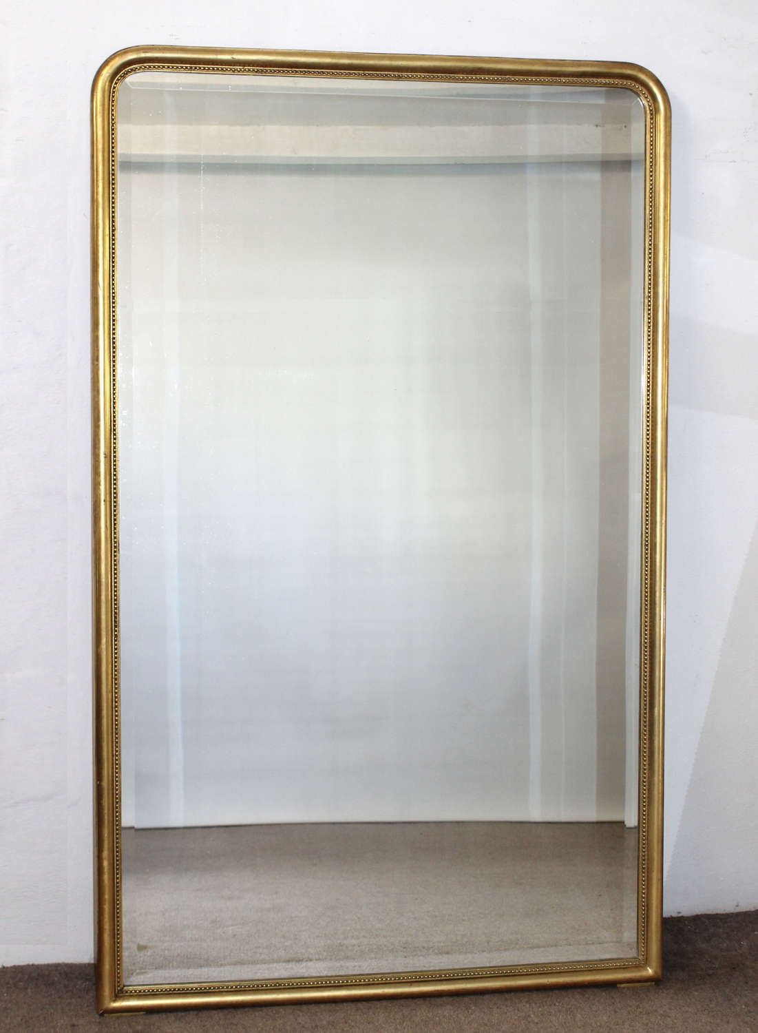 1920s French archtop mirror with narrow gilt frame
