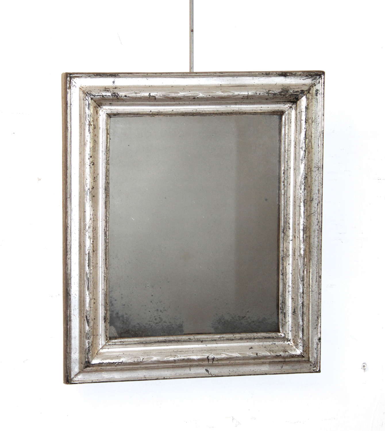 Small antique rectangular silverleafed framed mirror