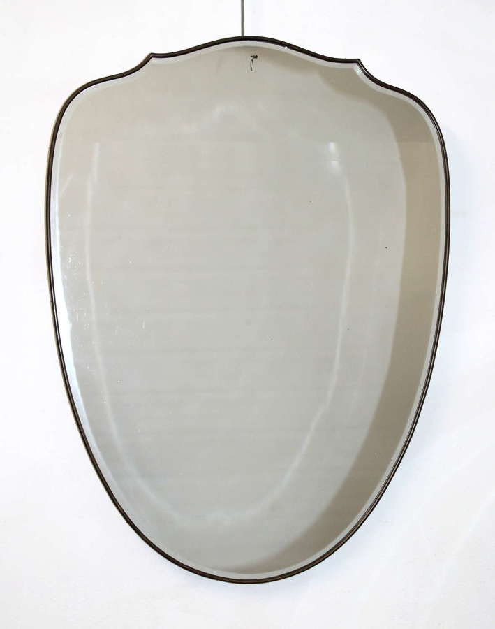 Vintage shield-shaped brass framed Italian mirror