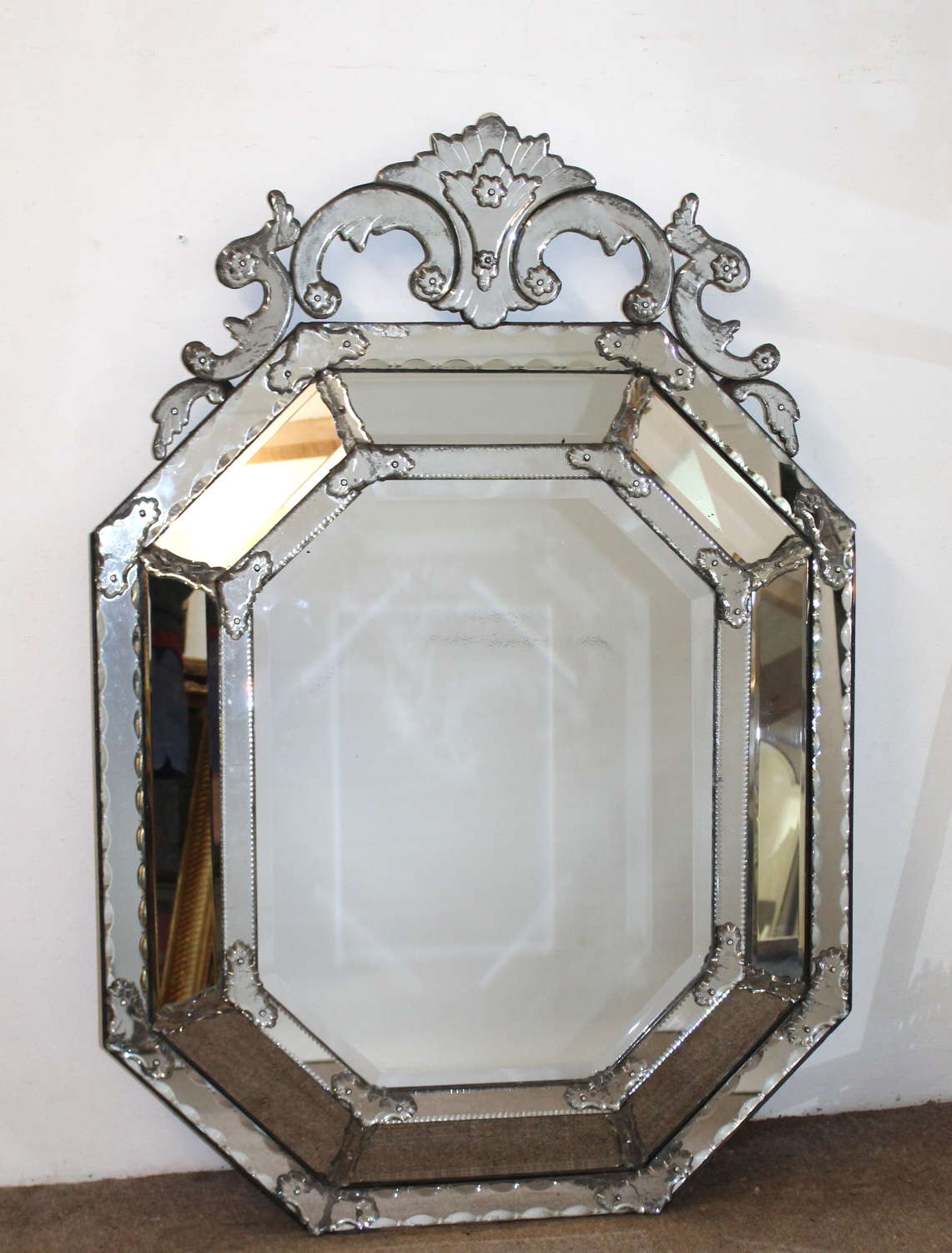 Antique octagonal cushioned mercury glass Venetian mirror