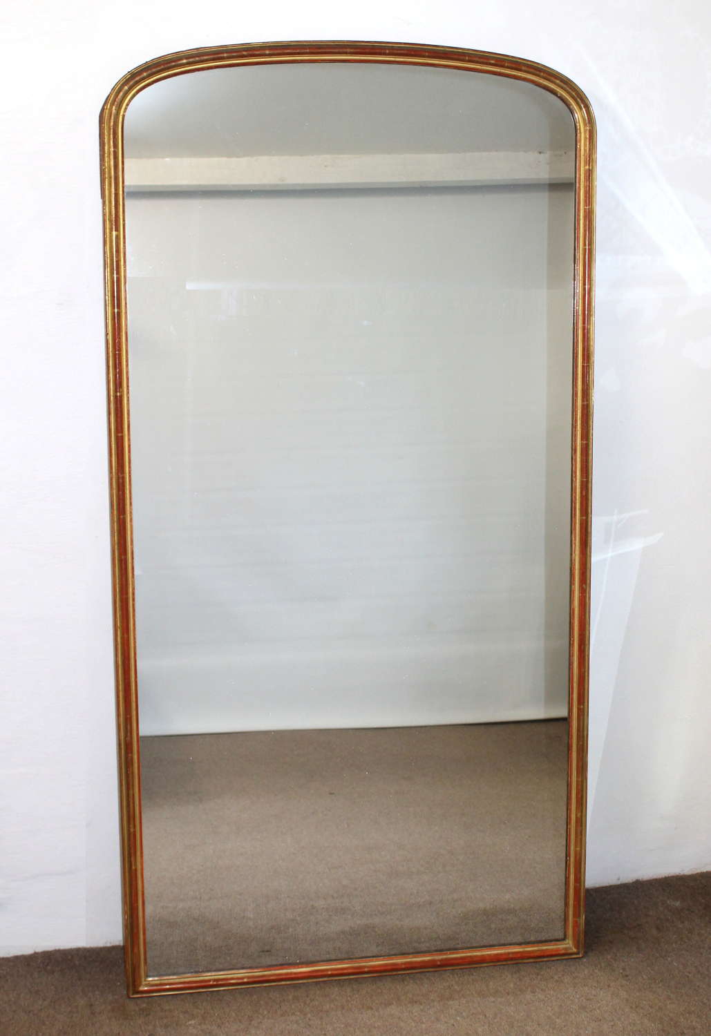 Tall antique French narrow-framed archtop mirror