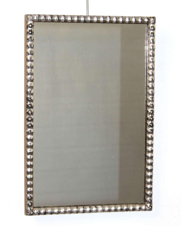 Small antique silverleafed mirror with undulating frame