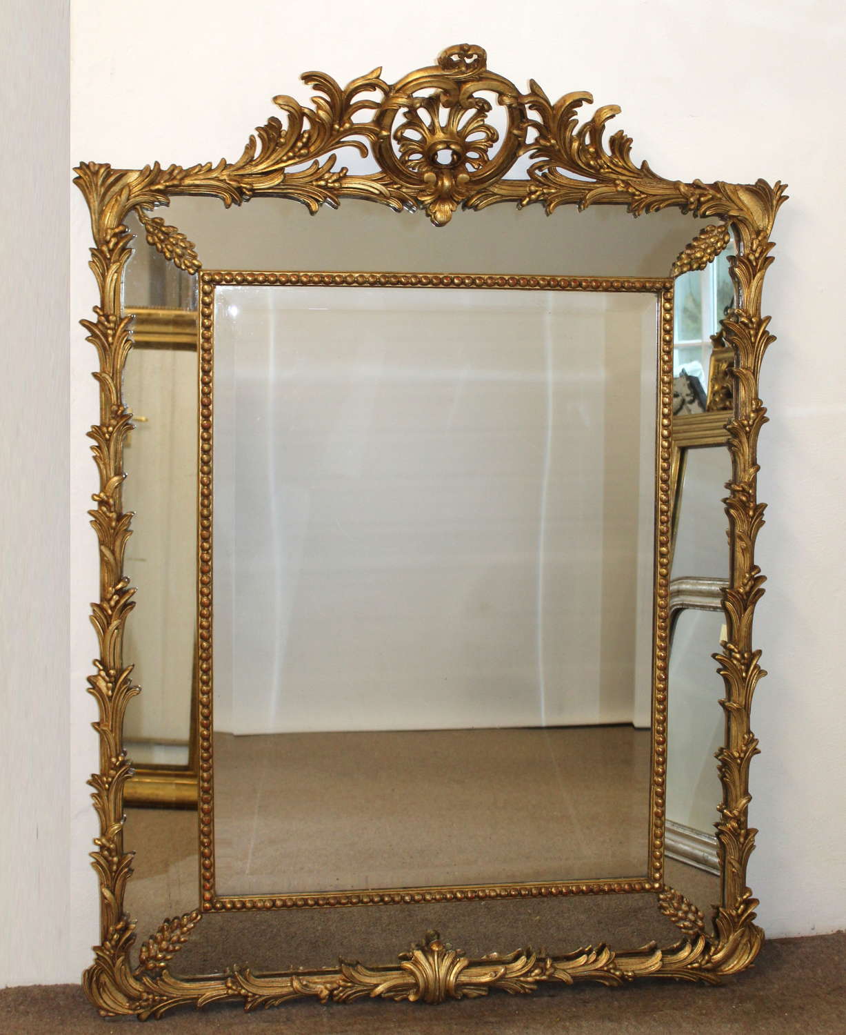 Antique French decorative gilt margin mirror with palm leaf frame