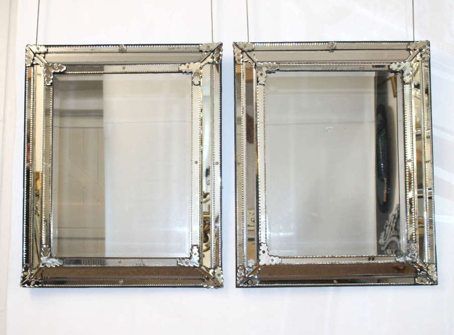 Pair of mid-19th century slightly cushioned Venetian mirrors