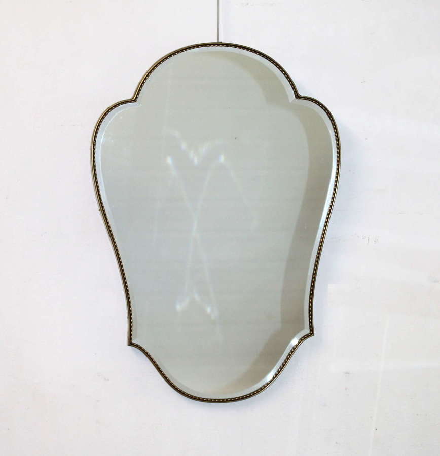 Curvy mid-century modern brass framed Italian mirror