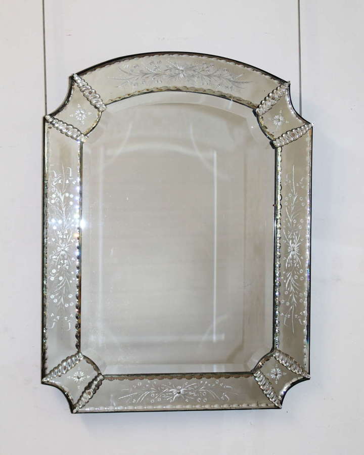 Antique Venetian mirror with re-entrant corners and decorative frame