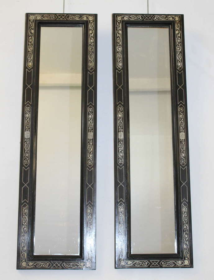 Pair of long, ebonised antique mirrors with decorative bone inlay