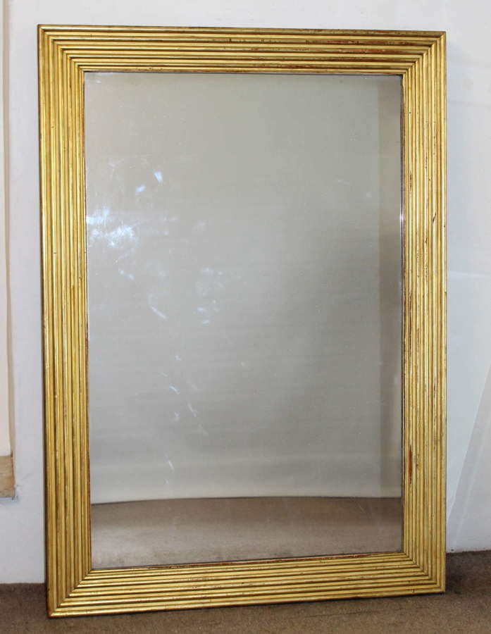 Large antique French mirror with wide reeded frame