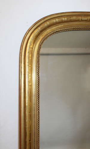 Large antique French curved top mirror with key pattern design