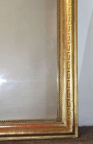 Large antique French curved top mirror with key pattern design