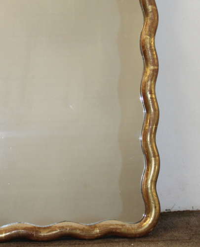 Pair of antique French gilt mirrors with wavy frames