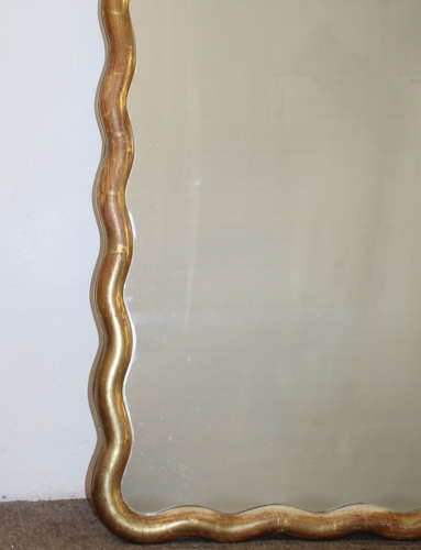 Pair of antique French gilt mirrors with wavy frames