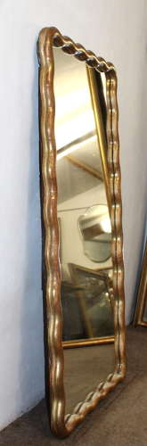 Pair of antique French gilt mirrors with wavy frames