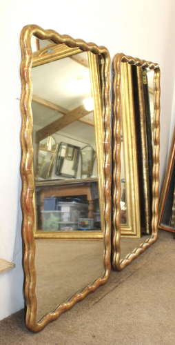 Pair of antique French gilt mirrors with wavy frames