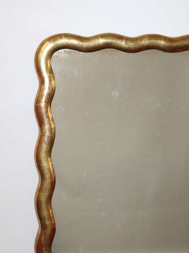 Pair of antique French gilt mirrors with wavy frames