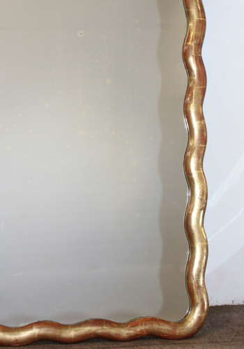 Pair of antique French gilt mirrors with wavy frames