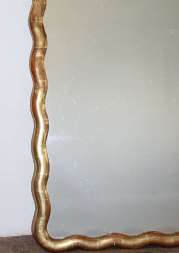 Pair of antique French gilt mirrors with wavy frames