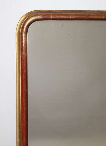 Antique French arched mirror with narrow gilt frame