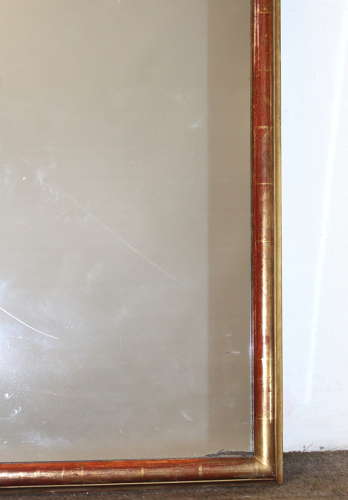 Antique French arched mirror with narrow gilt frame