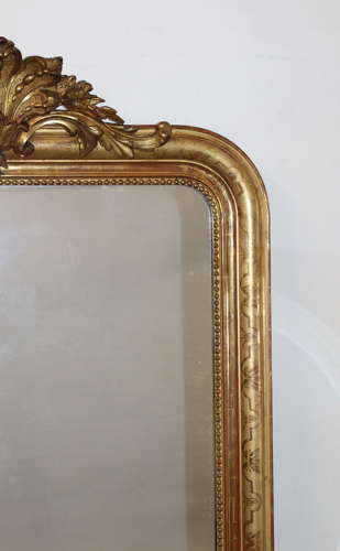 Antique French gilt archtop mirror with cartouche