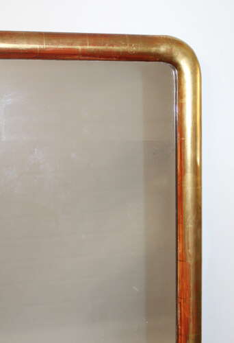 Antique French watergilt-framed archtop mirror