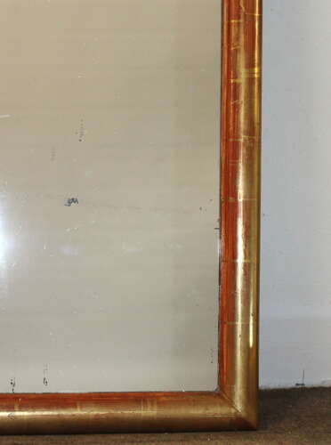 Antique French watergilt-framed archtop mirror