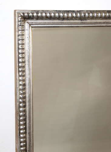 Antique French silverleafed mirror with partly decorative frame
