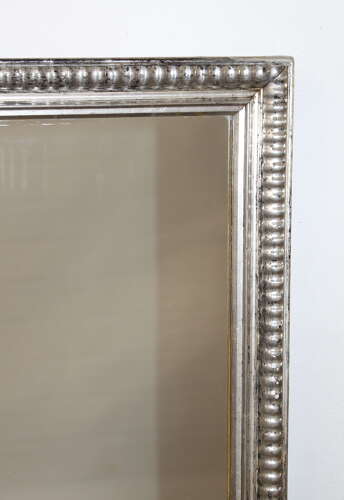 Antique French silverleafed mirror with partly decorative frame