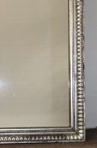 Antique French silverleafed mirror with partly decorative frame