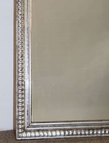 Antique French silverleafed mirror with partly decorative frame