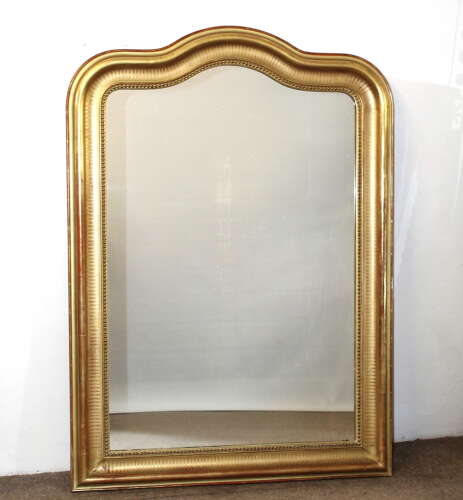 Antique French serpentine top banded gilt mirror