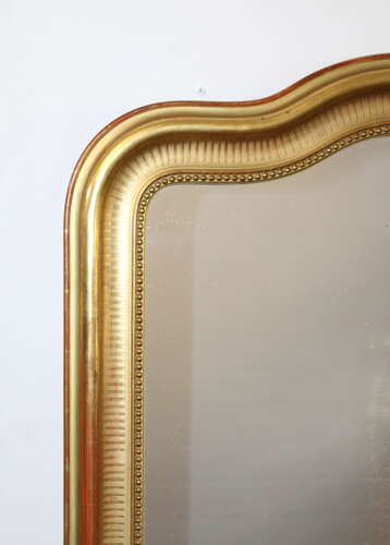 Antique French serpentine top banded gilt mirror