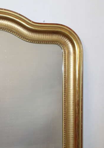 Antique French serpentine top banded gilt mirror