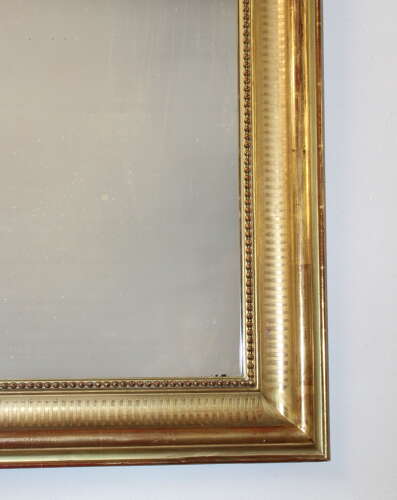 Antique French serpentine top banded gilt mirror