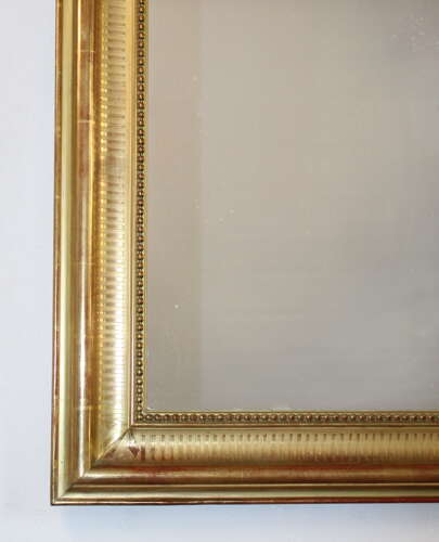 Antique French serpentine top banded gilt mirror