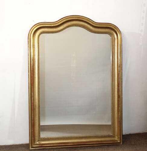 Antique French serpentine top banded gilt mirror