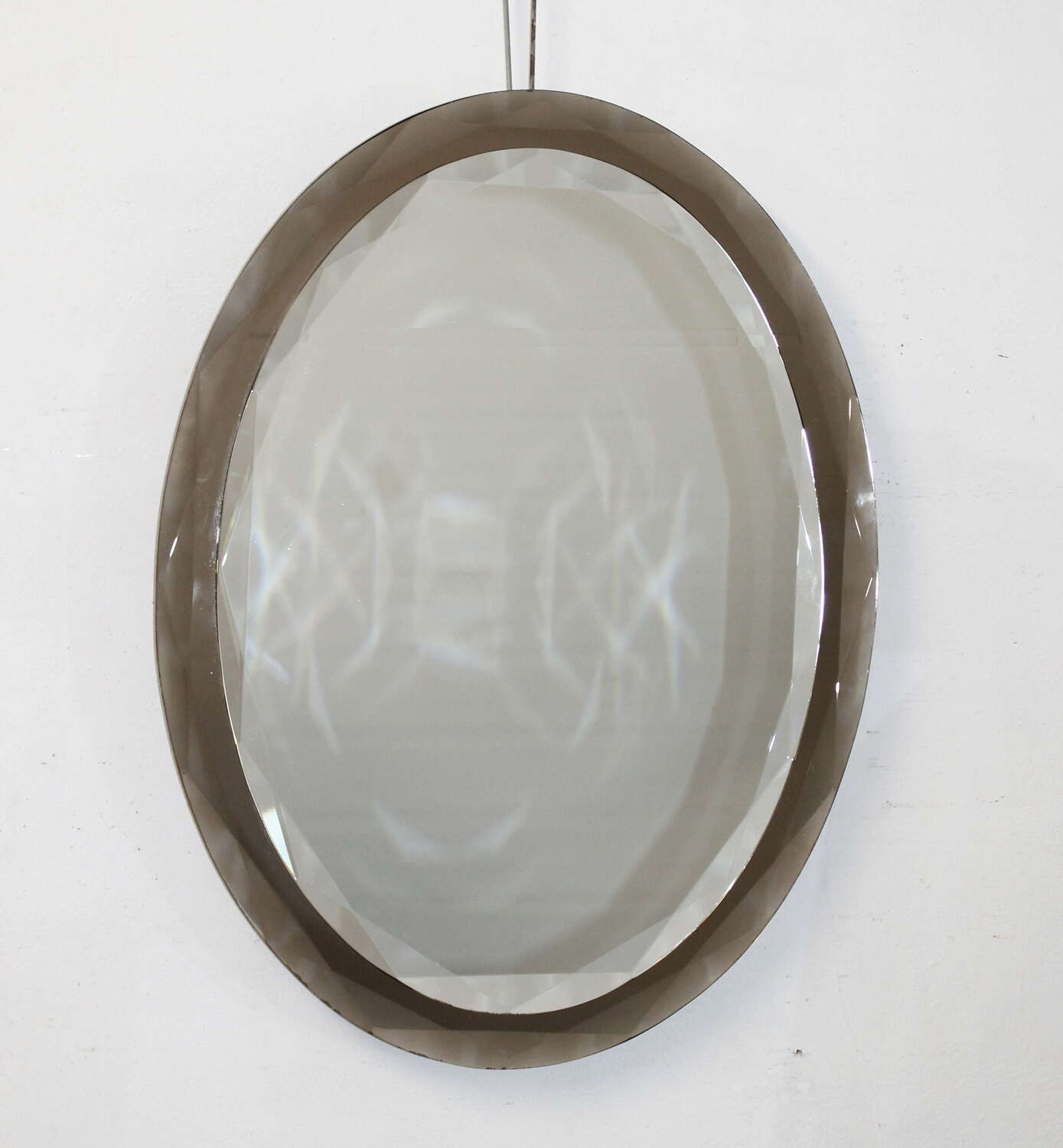 Vintage Italian oval mirror with geometric bevelling