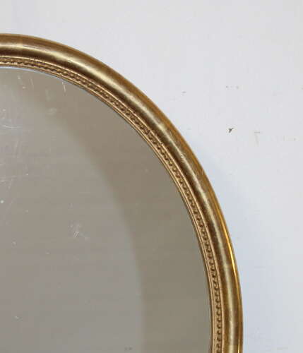 Antique French oval mirror with watergilt frame