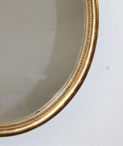 Antique French oval mirror with watergilt frame