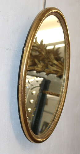 Antique French oval mirror with watergilt frame